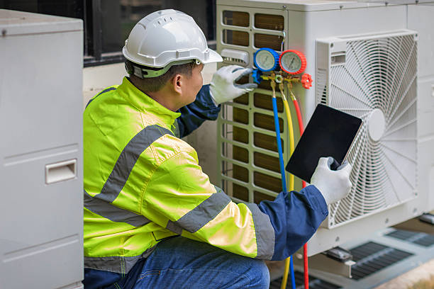 Professional Hvac technician working in Ballwin, MO